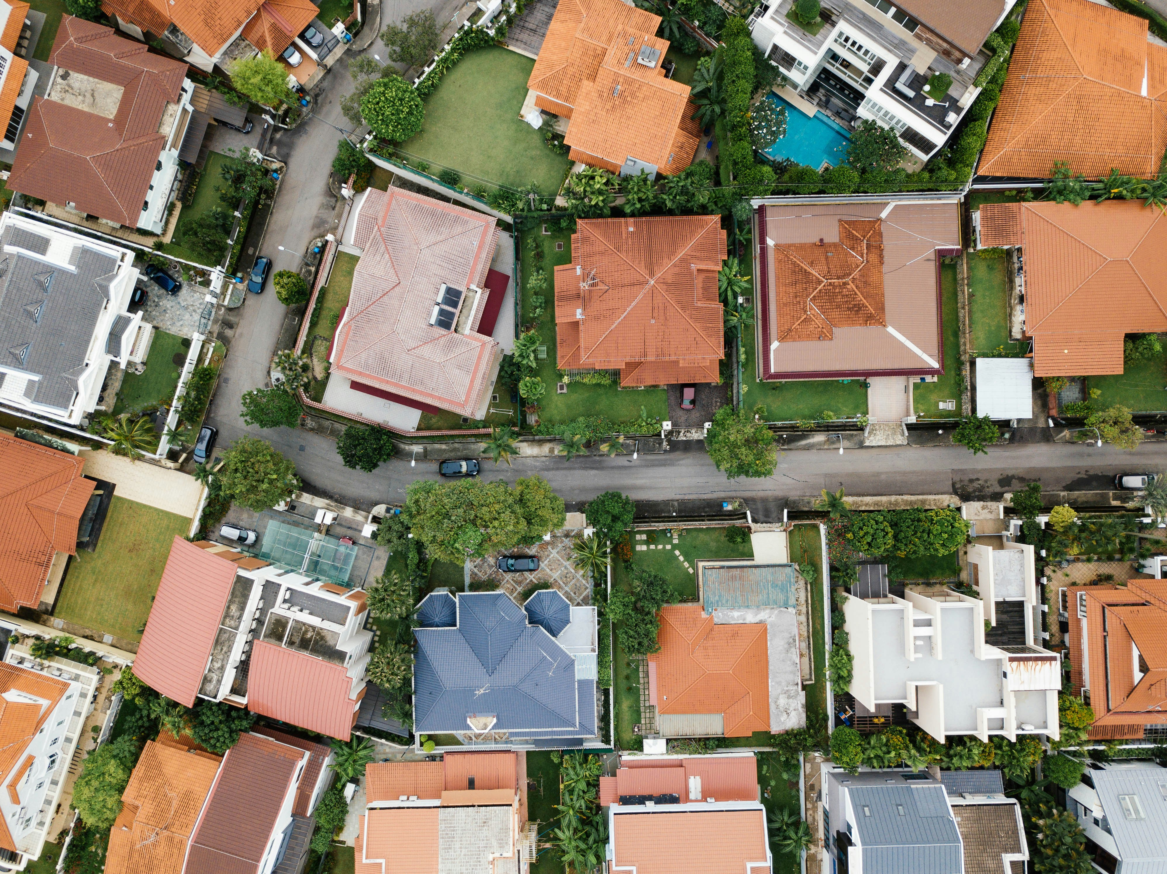 Aerial view of suburban Australian homes and streets, illustrating competitive residential property markets for home buyers